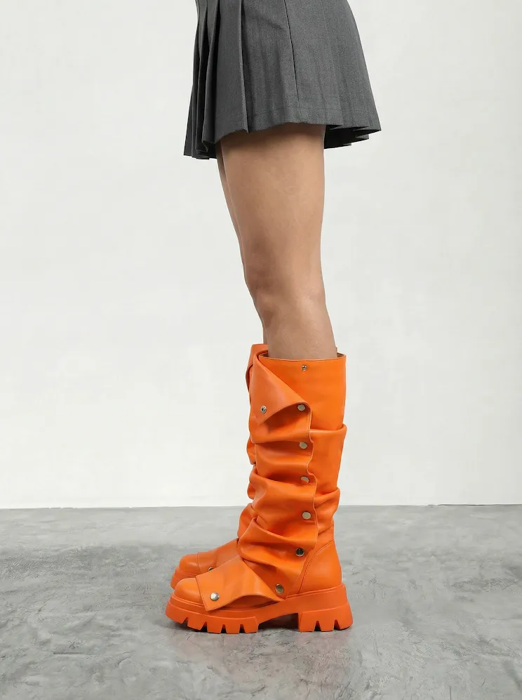 AI model in a grey pleated mini skirt wearing orange studded knee-high boots, generated with Veeton