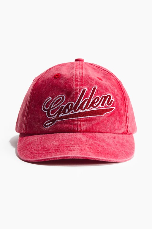 Packshot of a washed red baseball cap with Golden embroidery before on-model generation