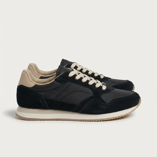 Packshot of black suede and nylon retro sneakers with beige trim before on-model generation