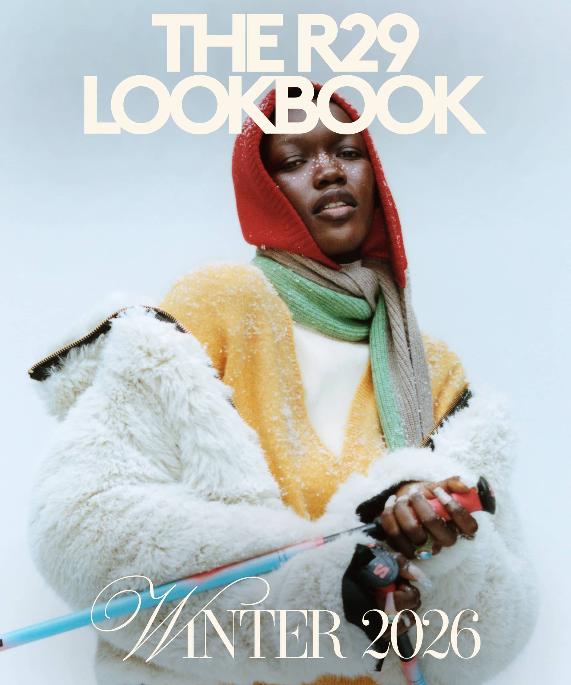 Cover of The R29 Lookbook Winter 2026 showing a model in a red hood, yellow cardigan and white faux-fur jacket