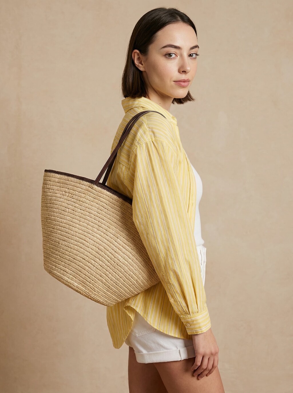 AI model in a yellow striped shirt carrying a straw tote bag with brown handles, generated with Veeton