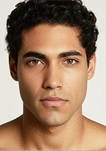 AI model headshot of a man with dark curly hair, chosen for the shoot