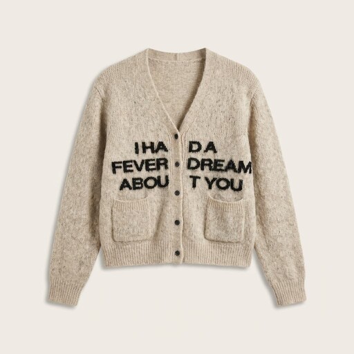 A cozy beige cardigan with a woolen texture features bold black text across the front reading, "I HAD A FEVER DREAM ABOUT YOU," and includes two front pockets and a buttoned closure.