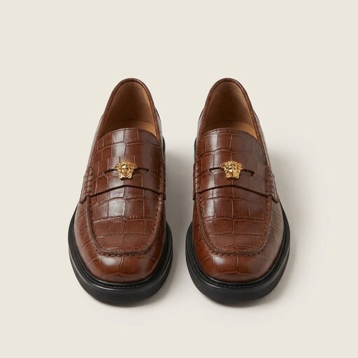 Packshot of brown croc-embossed penny loafers with gold hardware before on-model generation
