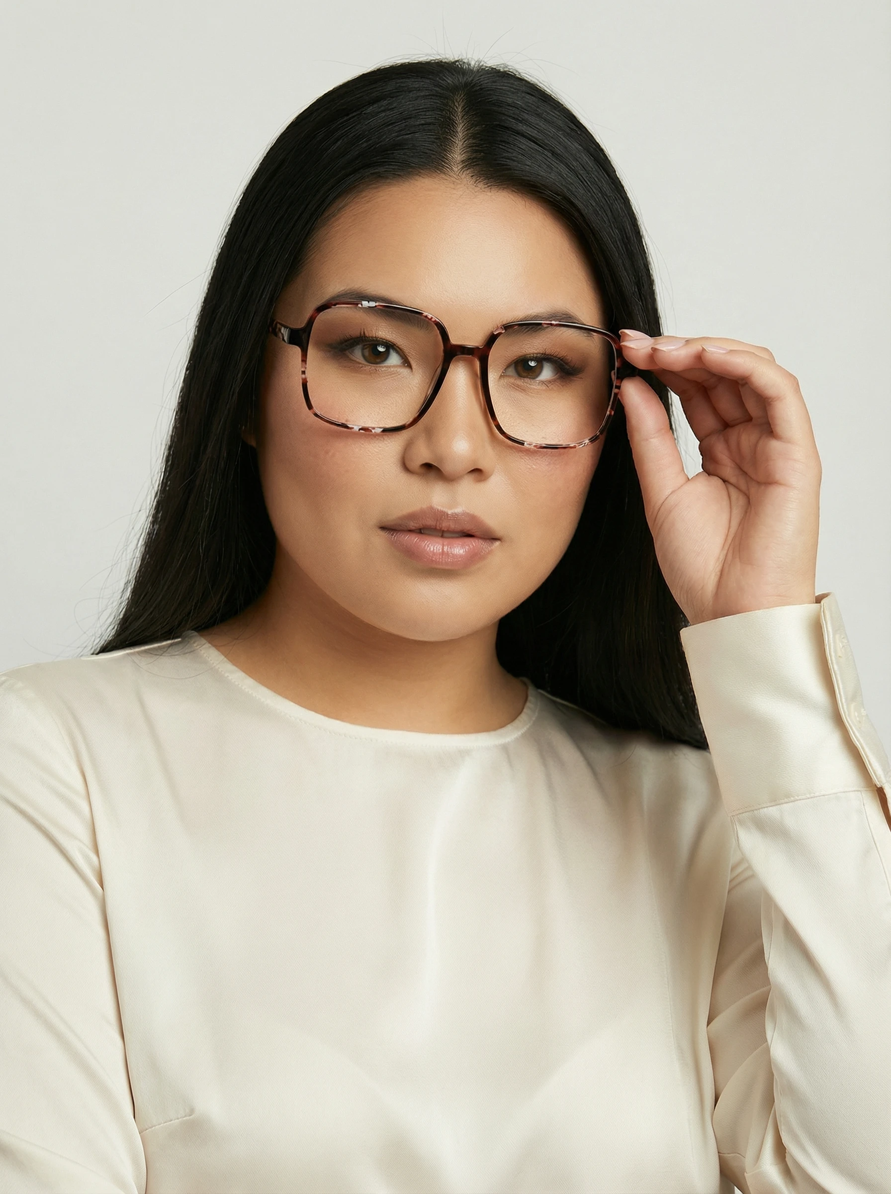 AI model in a cream satin blouse trying on square tortoiseshell eyeglasses, generated with Veeton