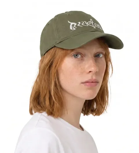 Before: a cap whose embroidered logo is distorted